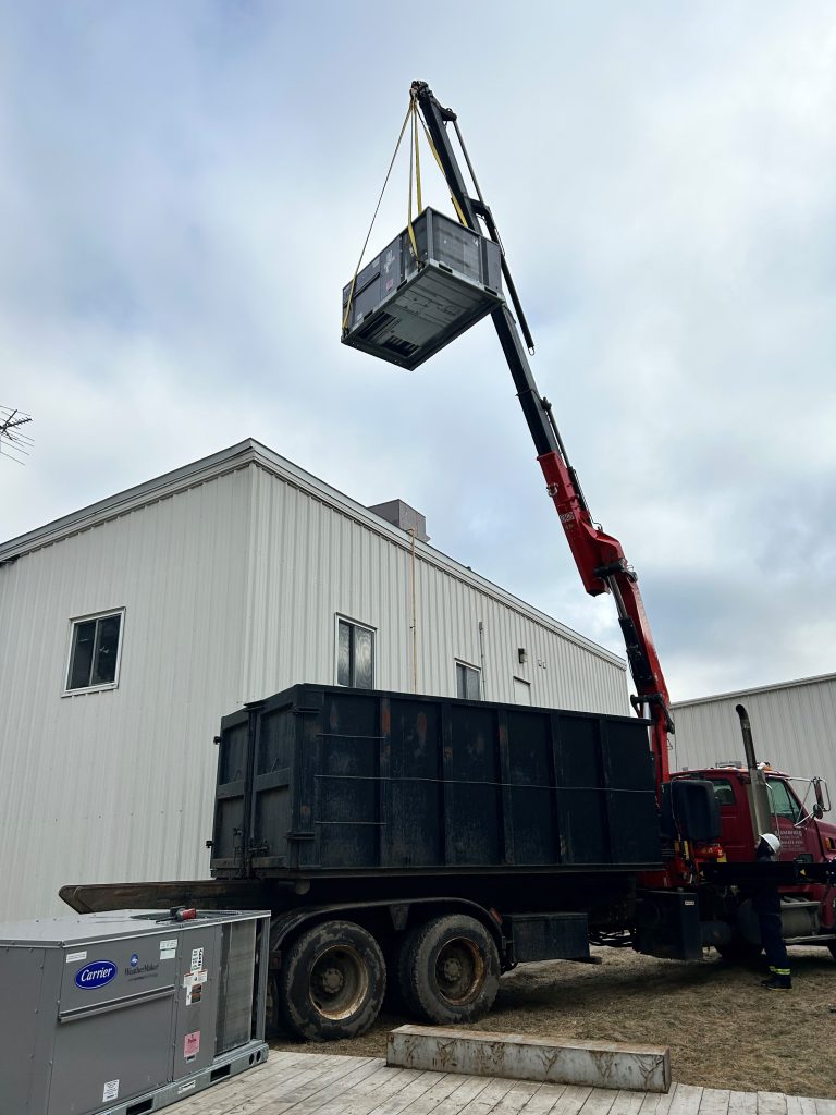 Roof top unit going on with crane